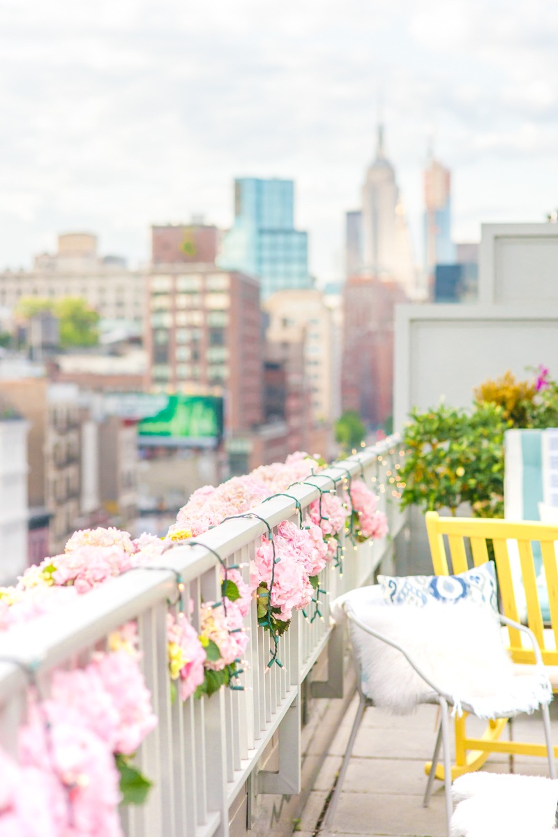 New York City Party Ideas Pink Hydrangeas White Twinkly Lights West Elm Pillow City Views